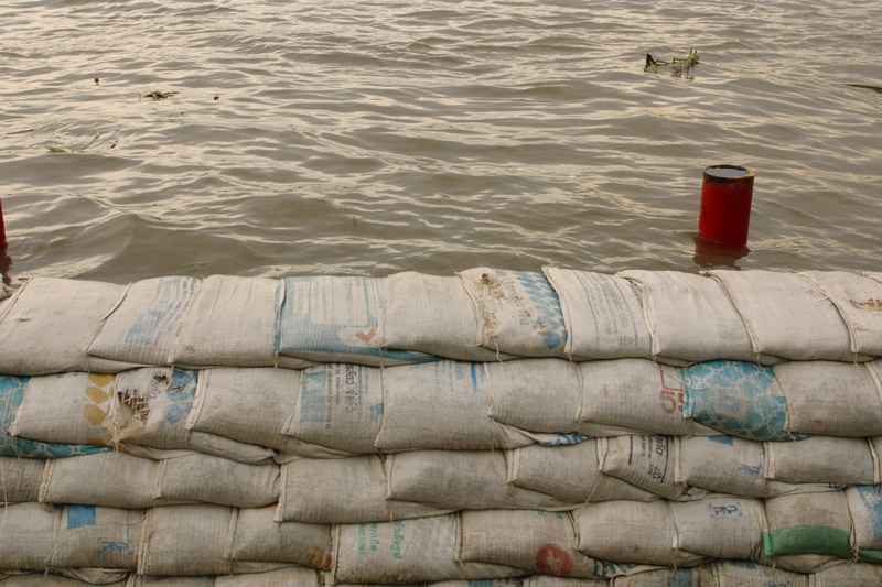 Sandbags along river to protect from a flood